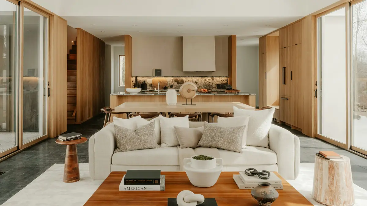 Warm, light-filled living room with natural wood and soft neutral furnishings